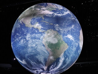 Dubai, UAE- March 31 2022: Blue ocean, green tropical forests and white clouds of planet earth. North and South America on globe is visible from low orbit Satellite in outer space.