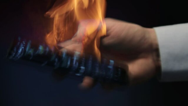 A man using a burning smartphone 