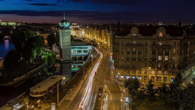 Sitkovska water-tower timelapse and traffic on road in old city center of Prague day to night.