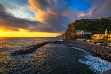 Sunset from the pier of Ponta do Sol in Madeira Island, Portugal