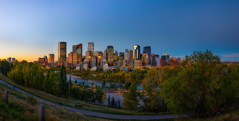 Sunset above city skyline of Calgary with Bow River, Canada