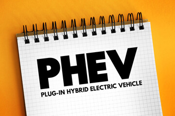 PHEV Plug-in Hybrid Electric Vehicle - hybrid electric vehicle whose battery pack can be recharged by plugging a charging cable into an external electric power source, acronym concept on notepad