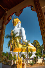 Fototapeta premium Wat Phrathat Doi Kham, Buddha pagoda and golden chedi in Chiang Mai, Thailand