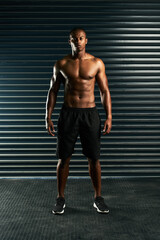 Obraz premium Built like a god. Full length portrait of an athletic young man posing shirtless in the studio.