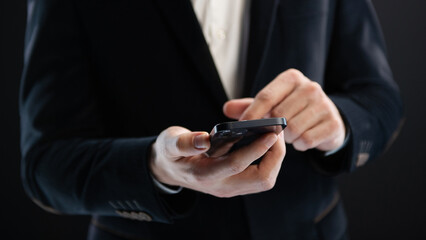 Business, finance and investment, forex trading, currency exchange, economic growth, stock market analysis concept. Man using mobile phone checking stock market graph report via mobile apps