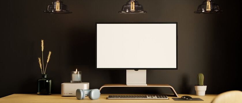 Luxury elegance dark workspace interior with pc desktop computer against black wall