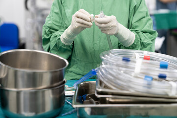 scrub nurse prepare equipments for emergency endovascular operation