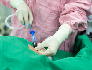 anesthesiologist doctor prepare invasive monitor for patient before surgery