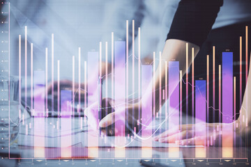 Multi exposure of woman hands typing on computer and financial chart hologram drawing. Stock market analysis concept.