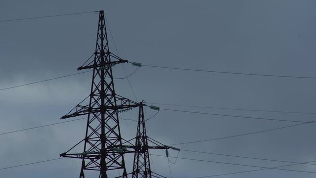 High voltage electricity transmission pylon. Power line supply with wire. High voltage electric tower with insulators. Electricity transportation industry energetics