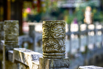 Sculptural stone pillars on the guardrail in a Chinese garden