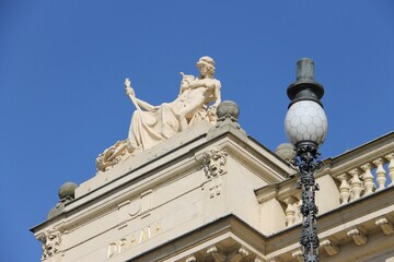 Fototapeta na wymiar Statue on a roof of a Theatre in Pilsen, Czech Republic
