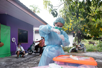 Nurse in protective clothing at covid testing site