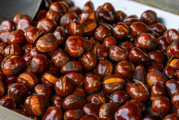 Pile of sweet candied fried chestnuts close-up