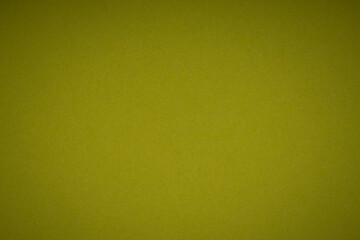 Unique mehendi green color textured paper background with vignette