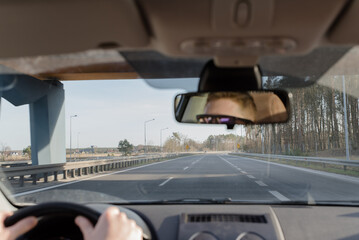 guy driving a car .Young man driving a car, interior shot