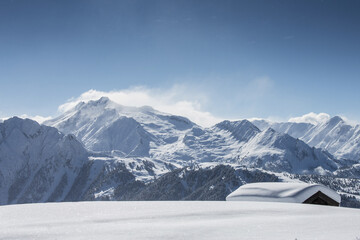 Beautiful winter landscape with lots of snow and mountains in the background