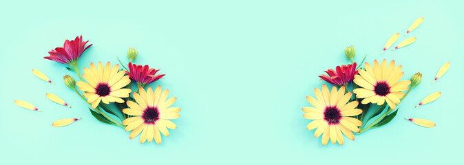 Fototapeta na wymiar Top view image of yellow and purple chrysanthemum flowers composition over blue background. Flat lay