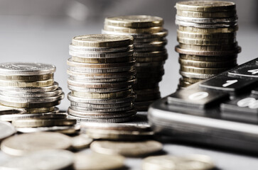 Lots of coins. The concept of investing or saving money or a financial crisis