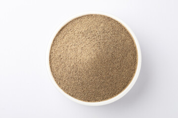 Indian spices - black pepper powder,Black pepper corns scattered on white background and Black pepper Powder on Glass bowl isolated on white background.