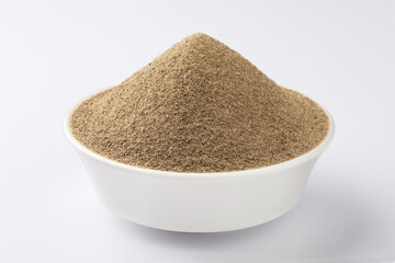 Indian spices - black pepper powder,Black pepper corns scattered on white background and Black pepper Powder on Glass bowl isolated on white background.