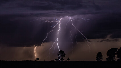 Dramatic sky with lightning strikes