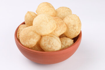 Panipuri or Golgappa is a popular street snack from India. It's a round, hollow puri filled with a mixture of flavoured water and other chat items © SMD IMAGES