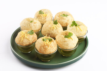 Panipuri or Golgappa is a popular street snack from India. It's a round, hollow puri filled with a mixture of flavoured water and other chat items © SMD IMAGES