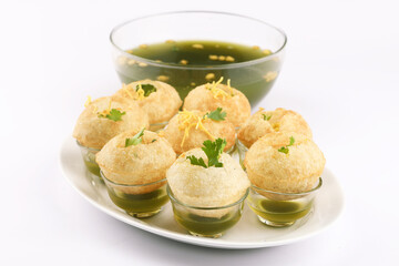 Panipuri or Golgappa is a popular street snack from India. It's a round, hollow puri filled with a mixture of flavoured water and other chat items © SMD IMAGES