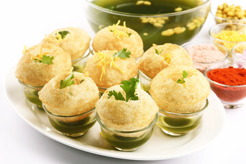 Panipuri or Golgappa is a popular street snack from India. It's a round, hollow puri filled with a...