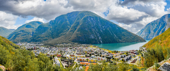 Panoramic shot of houses and fjord surrounded by mountains in Andalsnes, Norway