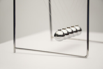 Close-up angle shot of the Newton's cradle.