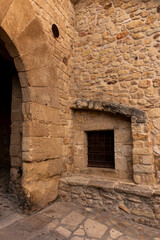 Naklejka premium old cobbled street in the medieval town of pals on the costa brava