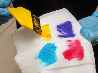 dye sample on a white background. a palette of many bright colors. modern trendy hairstyle in salon. hair dye kit.