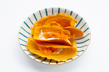 Thai crispy pancakes on white background.