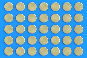 Rows of golden metal heads of nails on blue background. Building equipment. Luxury tool for repair; renovation. Expensive repairs. Top view. 3d render
