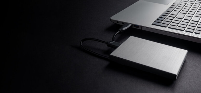The hard drive is connected to the computer via a cable. Backup. Secret information.