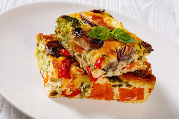a portion of baked in oven vegetable frittata
