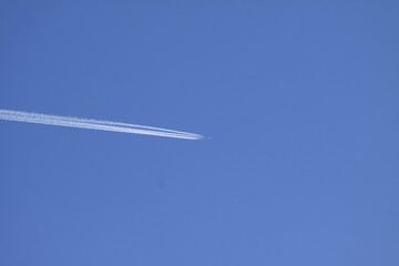 Airplane in the blue sky