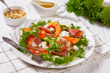 pumpkin salad with lettuce, crumbled cheese, ham