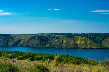 Landscape of beautiful River Dnister with Rocky Mountains in Bakota, Ukraine. Summer Travel serene minimalistic view . 