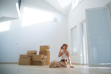 Young woman moving in her new modern house