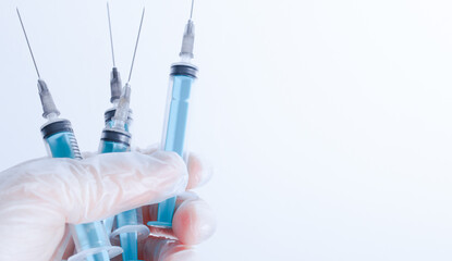 medical disposable syringe for injection in the hospital in the doctor's hand. the concept of vaccination and medicine