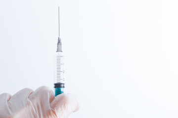 medical disposable syringe for injection in the hospital in the doctor's hand. the concept of...