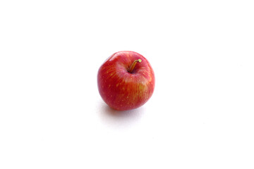 Red apple isolated on white background. Ripe red apple on a white background. Red apple in natural light.