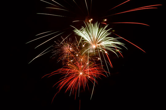 Fireworks explosion. The fireworks light up the sky with a dazzling spectacle. Fireworks of various colors exploding against a black background.