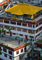 A panoramic view of tourists loitering around Drukpa Kagyud Monastery at Dali in Darjeeling. This is a popular monatery here and it was build by Kyabje Thuksey Rimpoche in 1971.