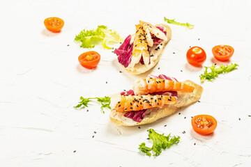 Open sandwiches with boiled shrimps, cream cheese, salad leaves, and cherry tomatoes