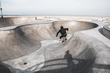 Foto op Plexiglas View of a boy skateboarding in a skateboard park © Andreas Eriksen/Wirestock Creators