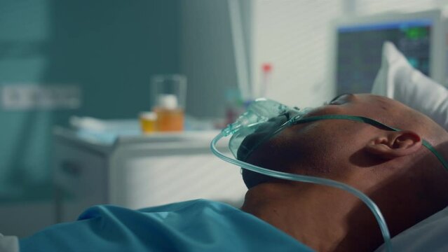 Doctor take tubes covid19 for clinic test. Patient lie in oxygen mask closeup